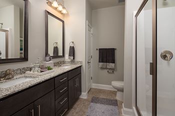 interior model bathroom with double vanity sinks